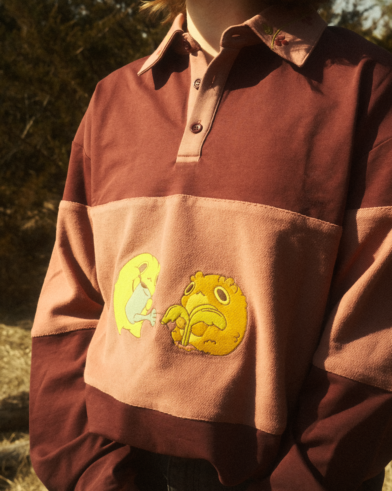 burgundy rugby shirt with embroidered frogs on the front