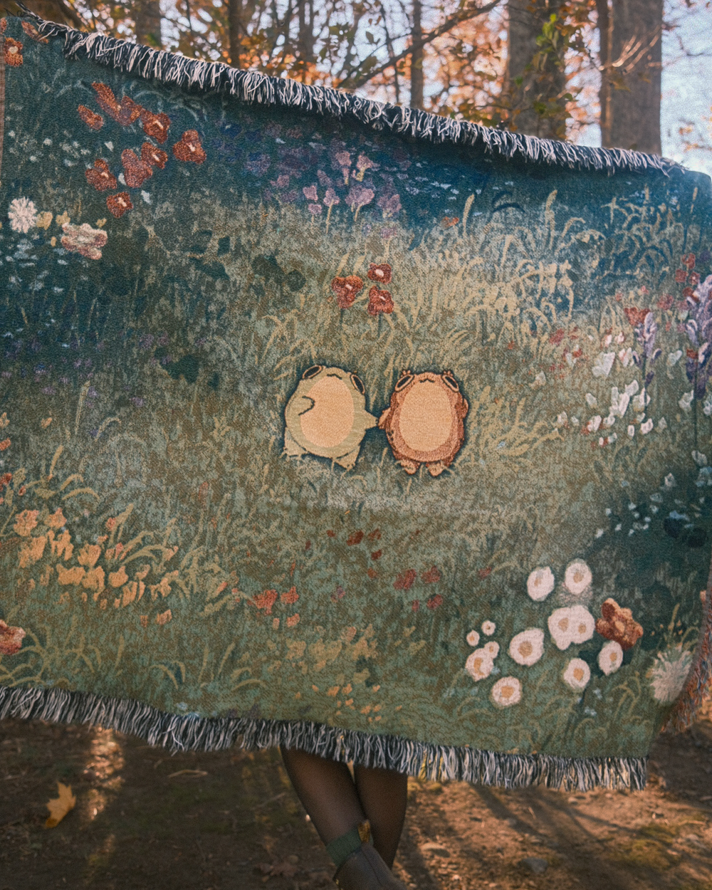 throw sized woven tapestry blanket of two frogs holding hands in a flowery field