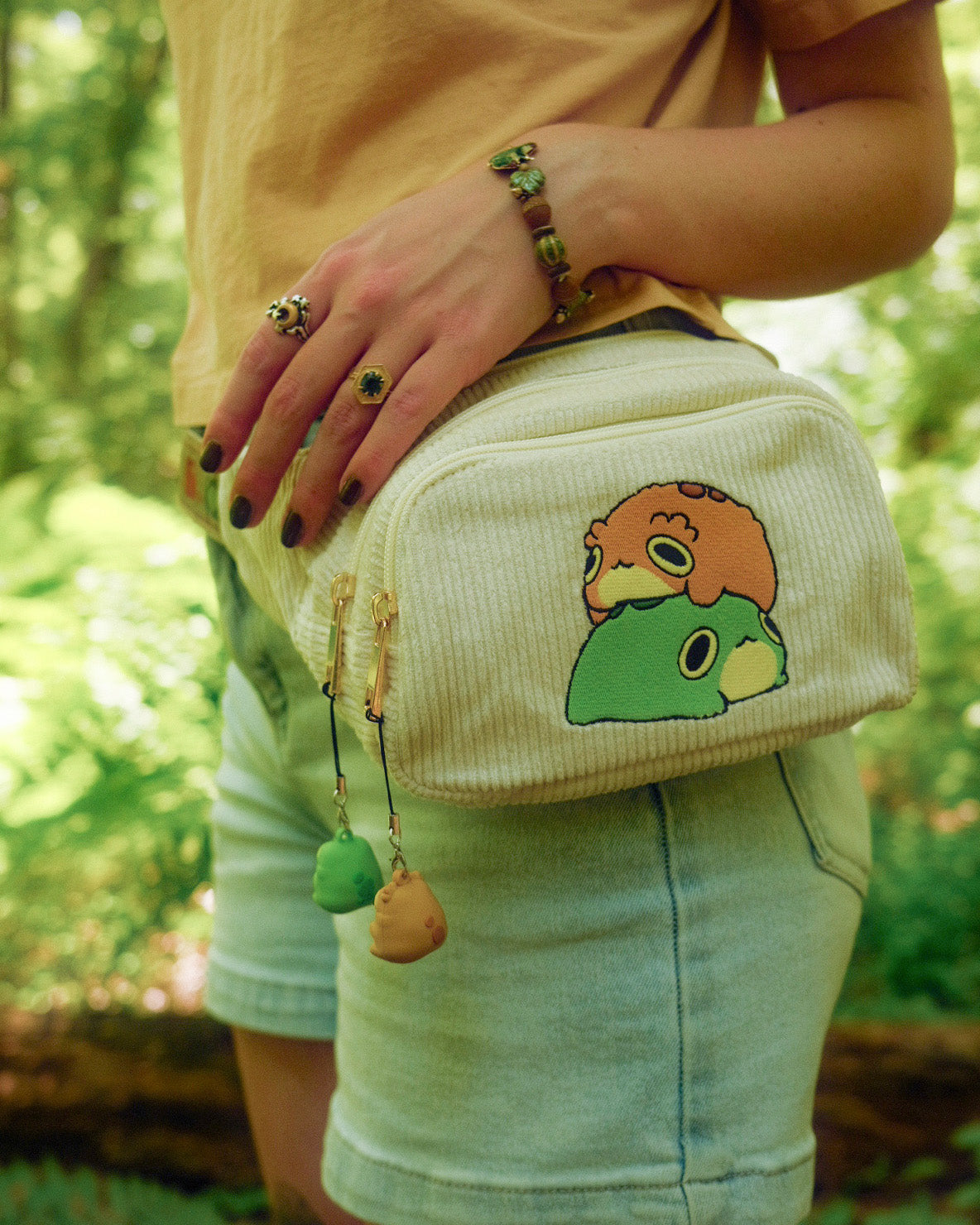 fanny pack wit two frogs stacked on top of each other embroidered on the front