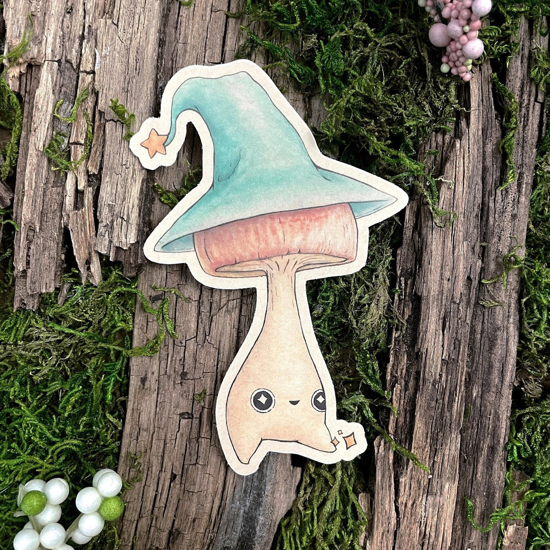 A sticker depicting a cute mushroom wearing a wizard's hat