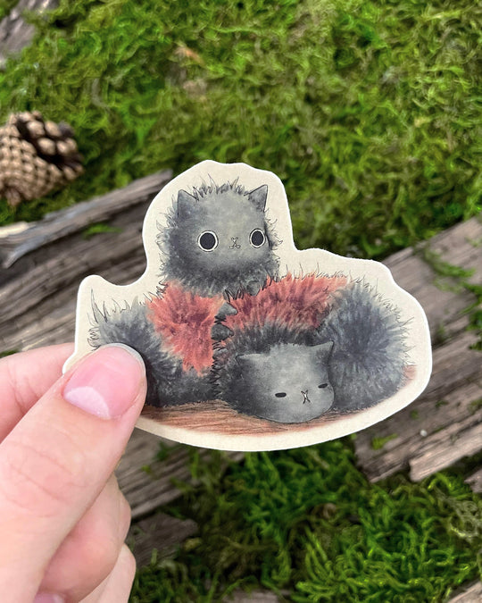 sticker of cartoon cat-erpillar based on cats and woolly bear caterpillars ith thumb for size reference