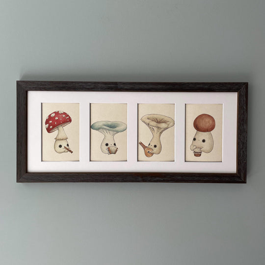 four individual prints of four mushlings playing various instruments in a frame