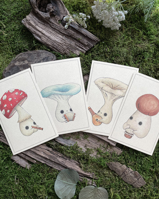 four individual prints of four mushlings playing various instruments 