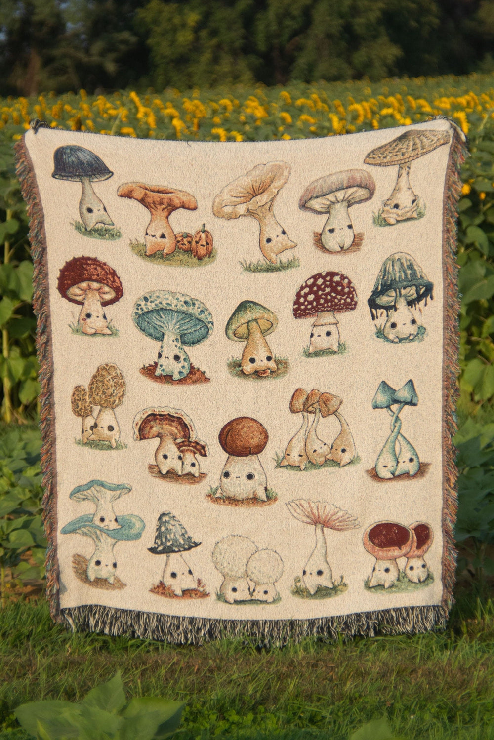 woven throw blanket depicting mushroom characters