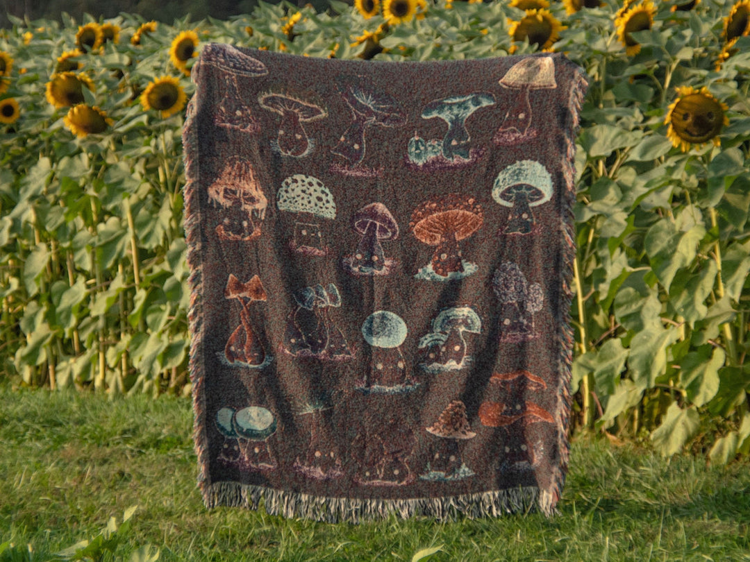 woven throw blanket depicting mushroom characters reverse side with inverted colors