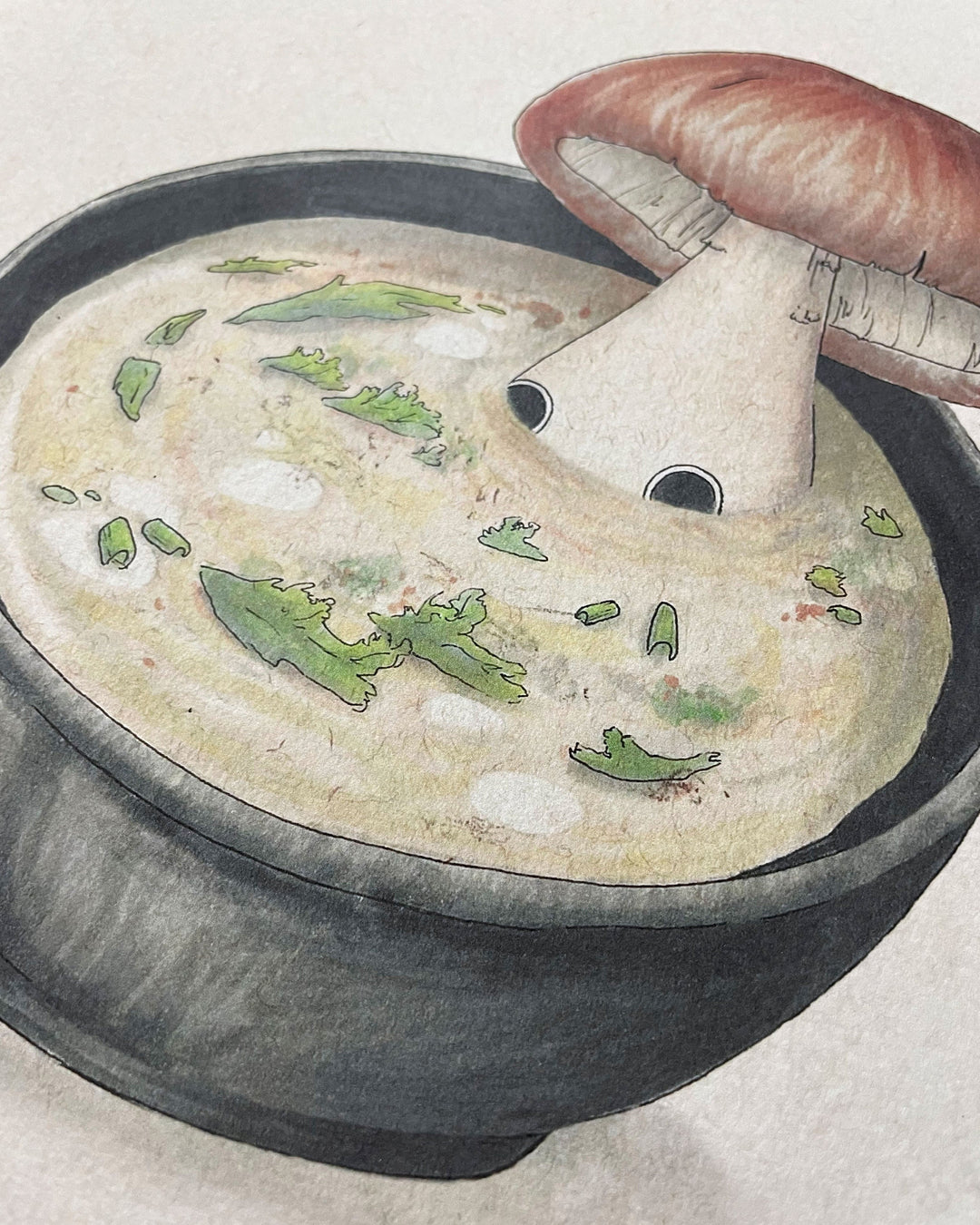 print of mushroom character laying in soup closeup