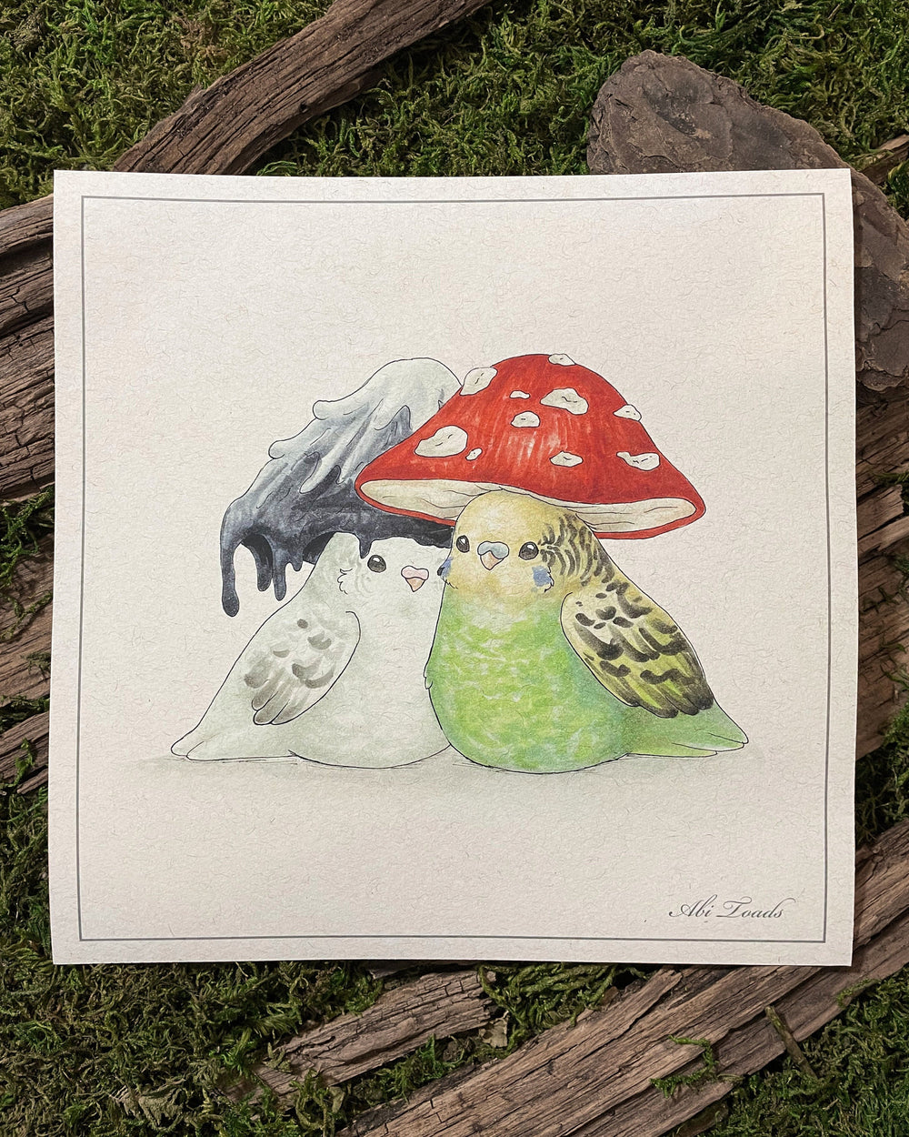 A print of two lovebirds with mushroom-shaped hats on their heads