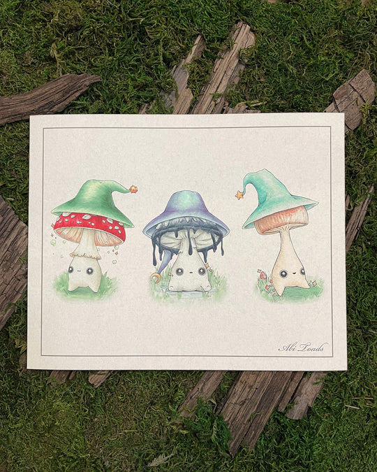 print of three mushroom character wizards