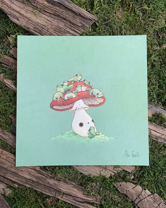 print of red capped mushling with many frogs sitting on top of his head