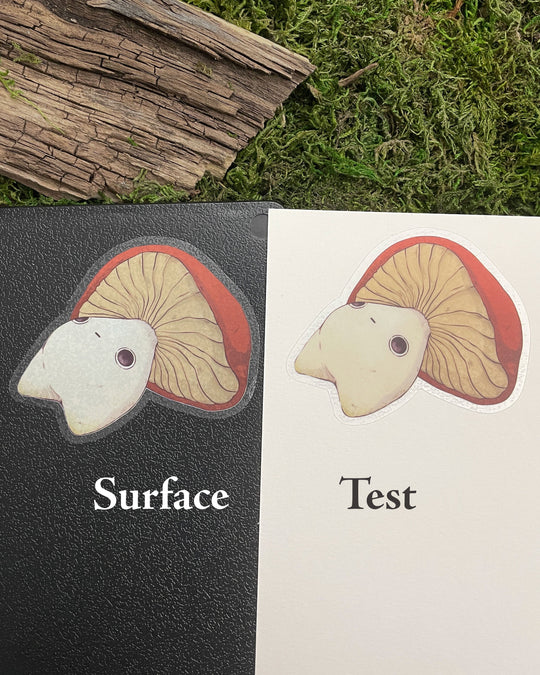 mushroom character sticker on two different backgrounds for reference on a dark surface vs a light surface