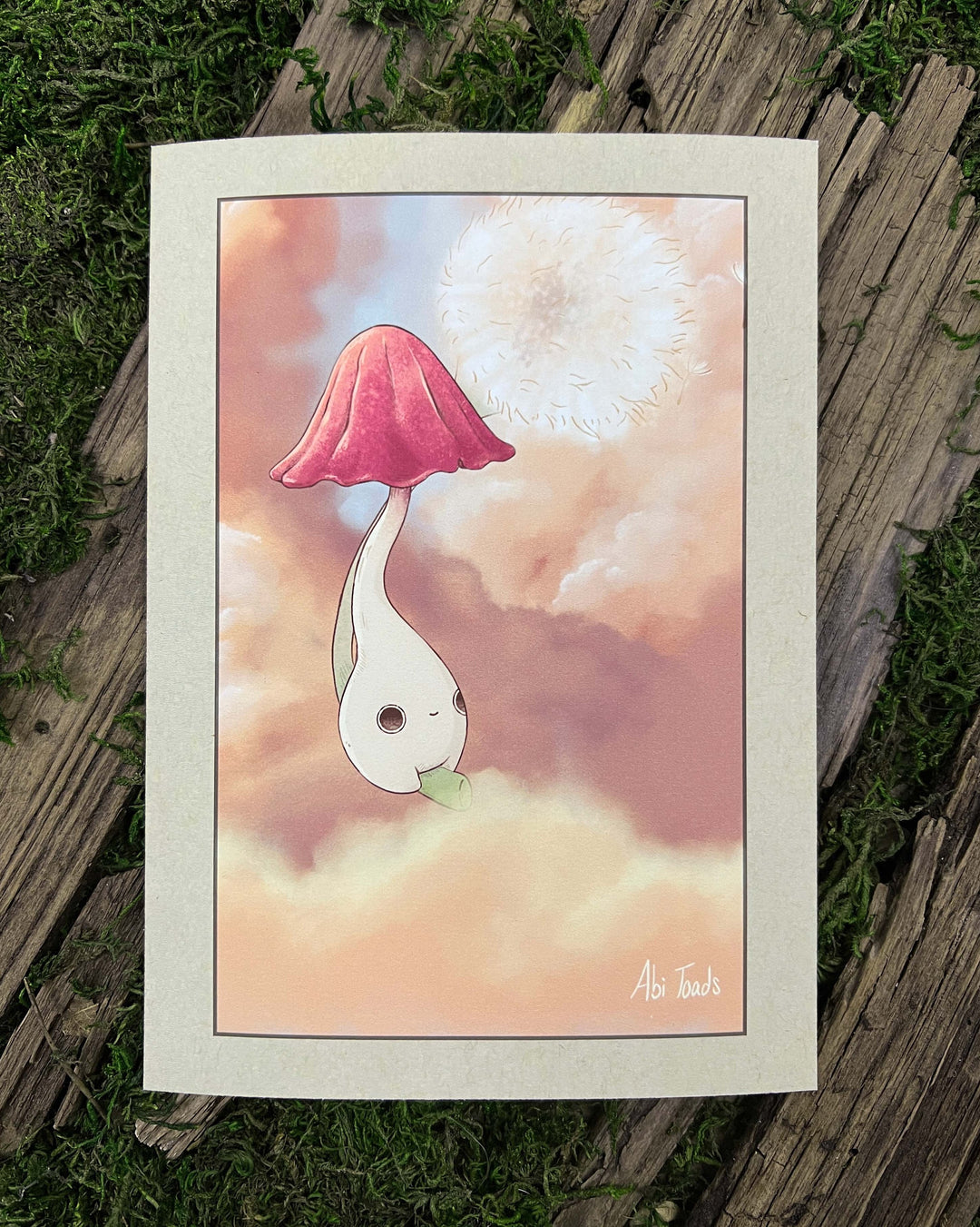 print of a dainty pinkish mushling riding a dandelion through clouds during a sunset