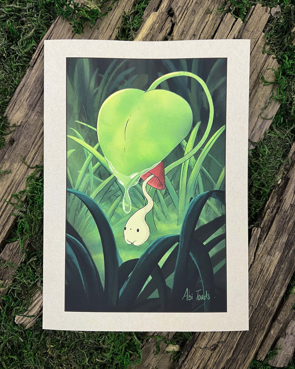 A whimsical artwork of a small mushroom with a red cap and long stem, hiding under a large leaf in a forest setting.