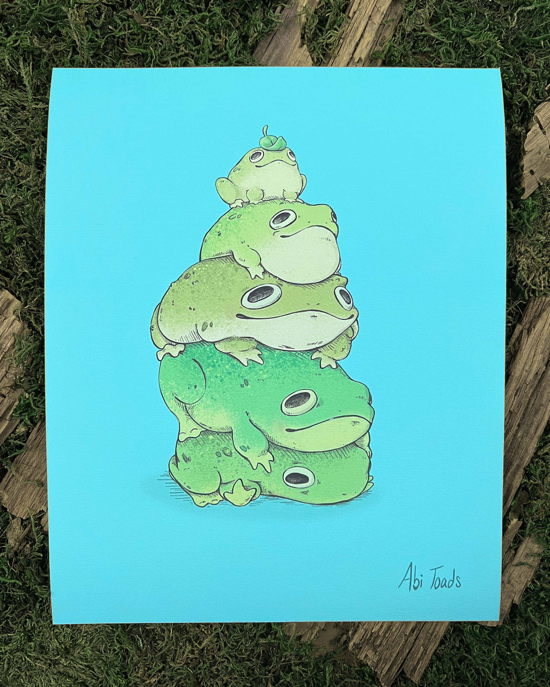 print depicting four frogs stacked on top of each other