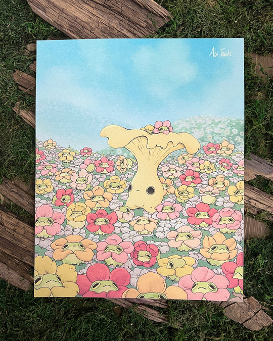 print of chanterelle mushling character surrounded by frogs in flower necklaces