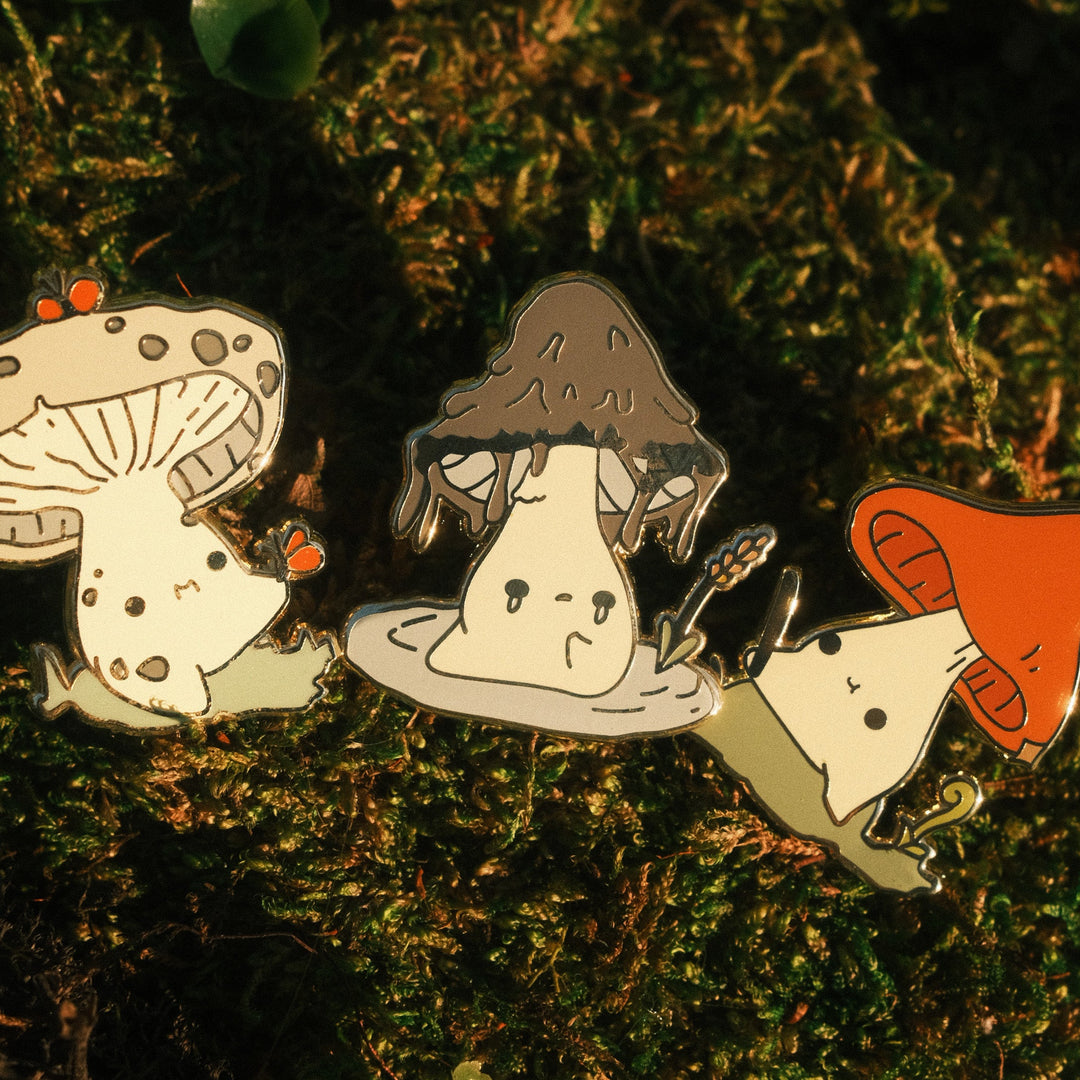 three mushling pins closeup on a mossy background