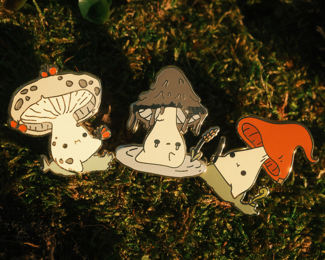 three mushling pins on a mossy background