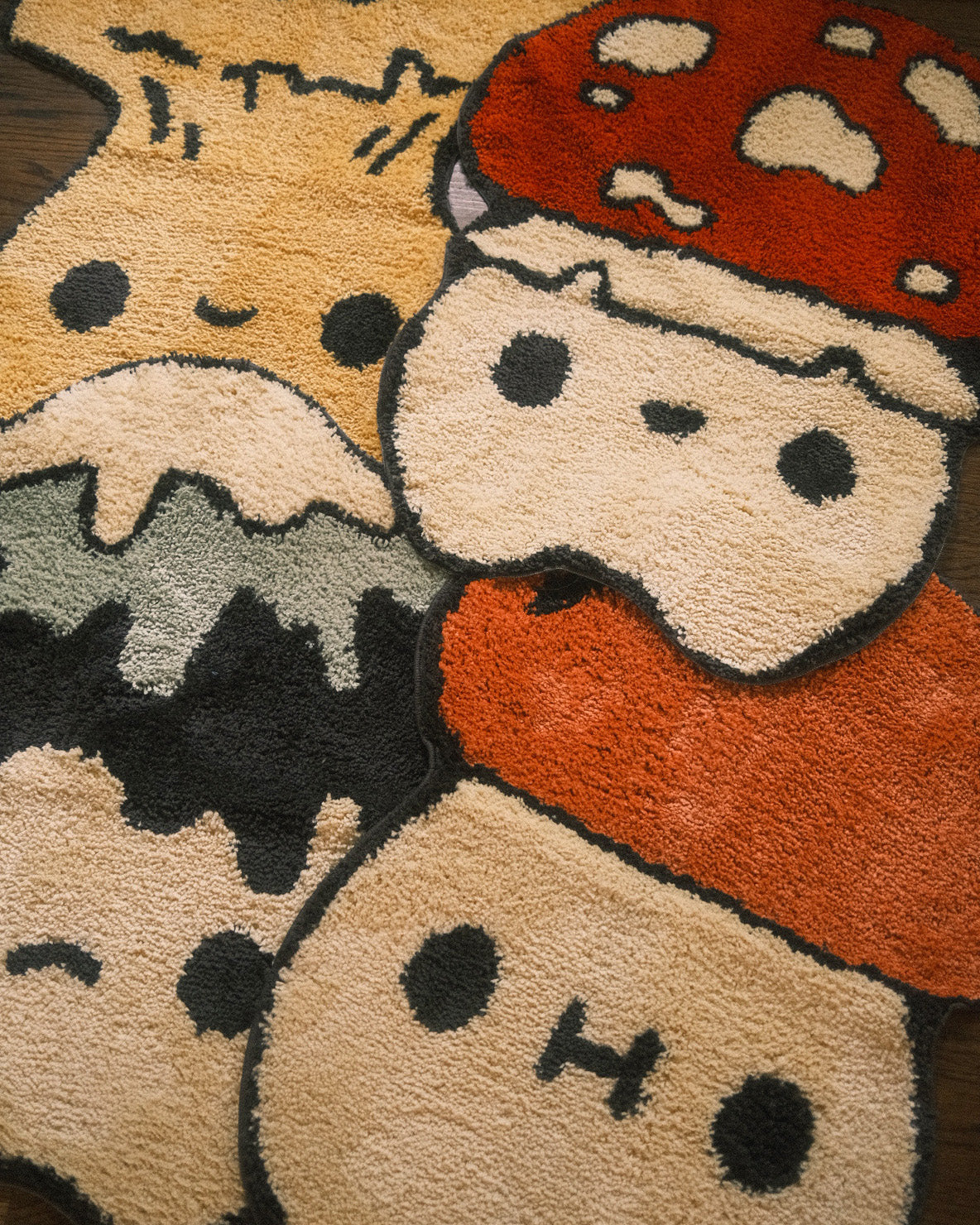 four various mushroom shaped rugs