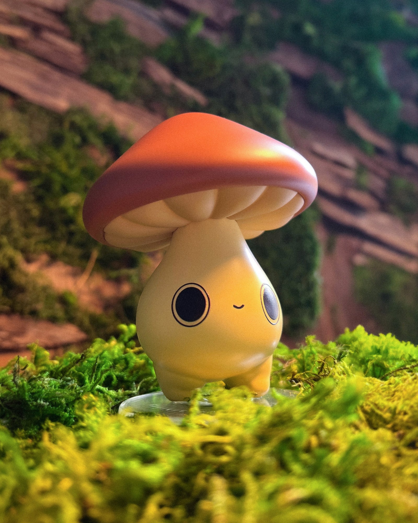 Mushroom-shaped figurine with a face on a grassy background