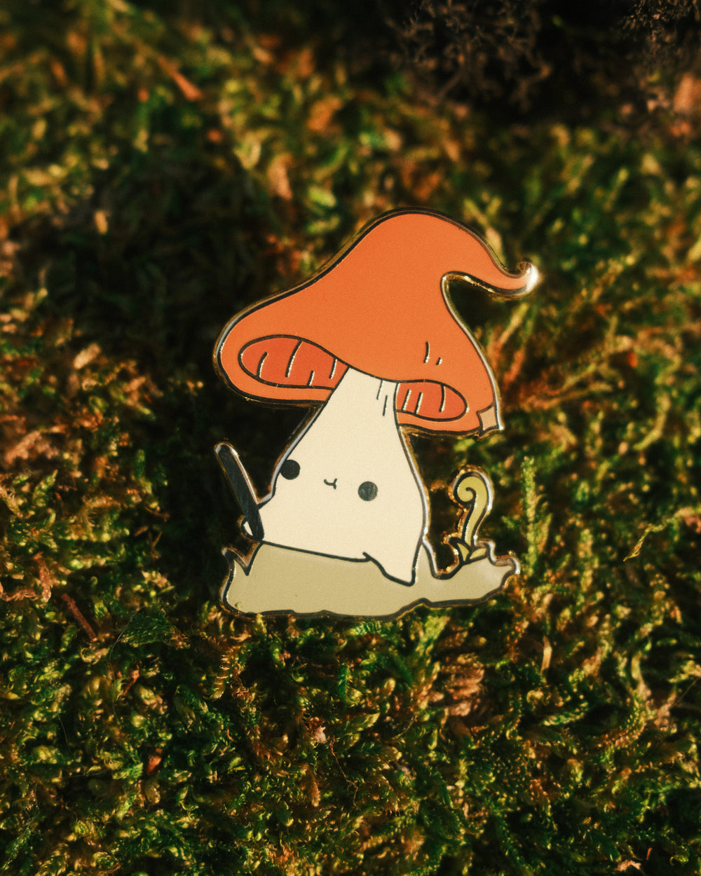 witch hat mushling pin on a mossy background