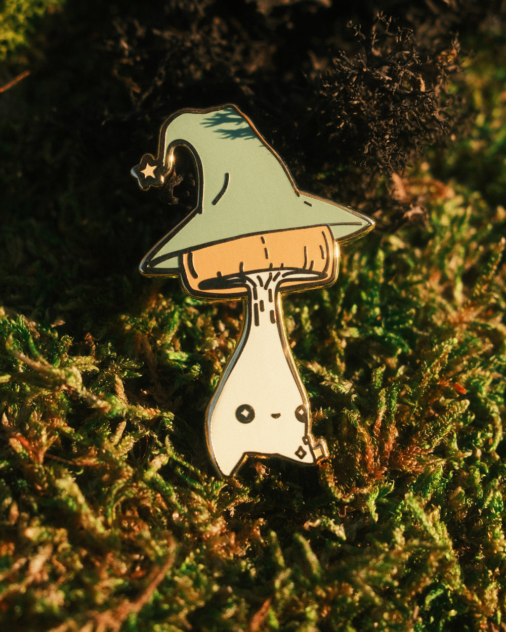 pin of a wizard mushling on a mossy background