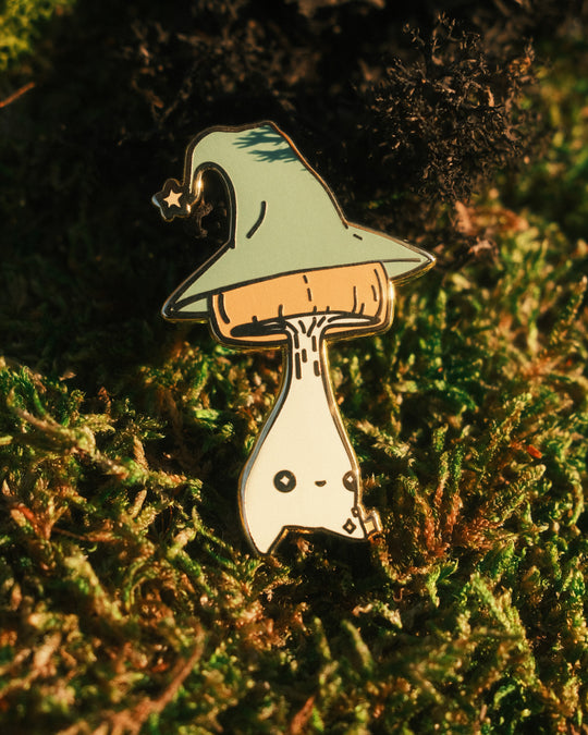 pin of a wizard mushling on a mossy background